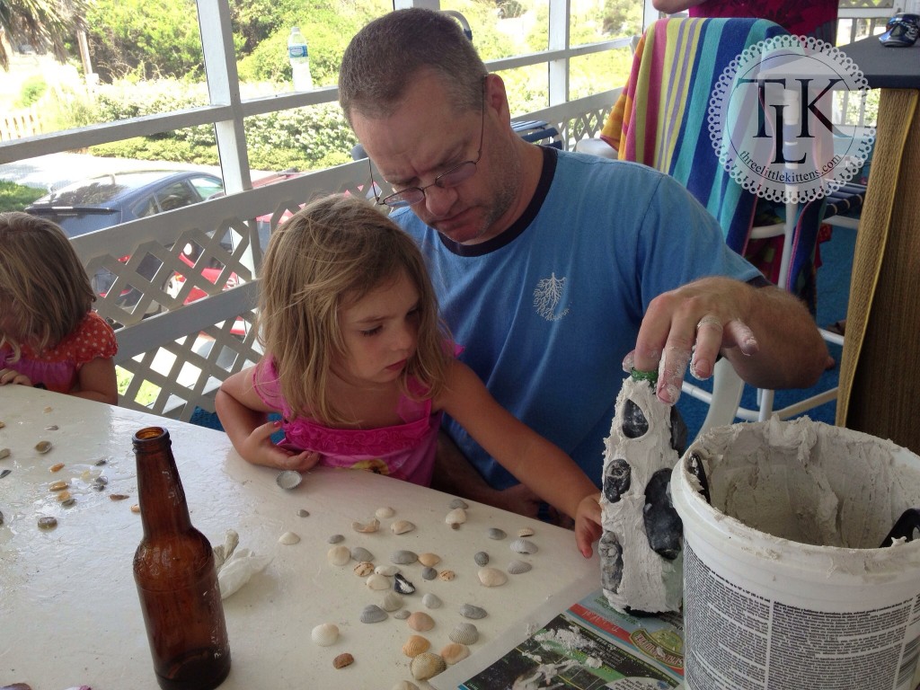 Caroline and Daddy work on a vase