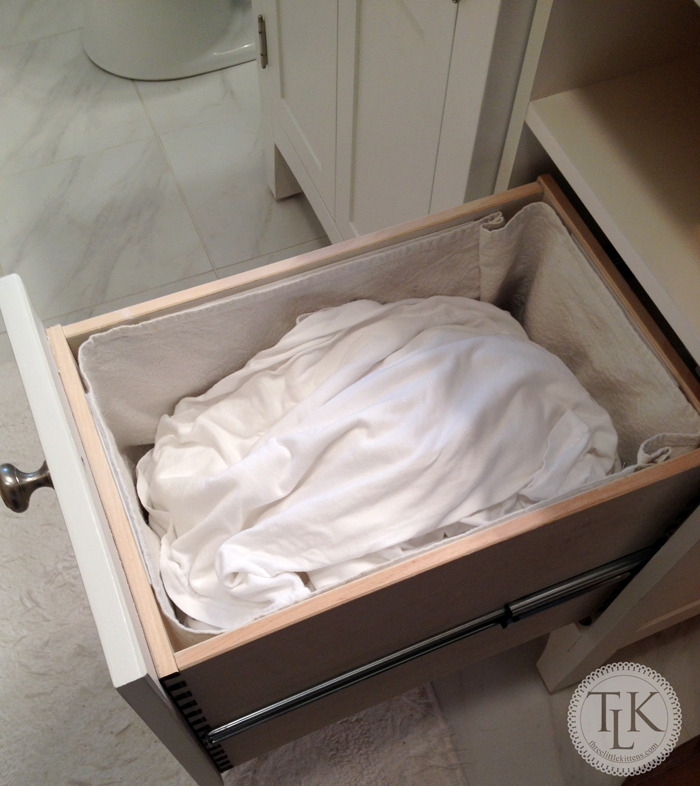 Turn A Cabinet Into a Clothes Hamper on threelittlekittens.com/blog