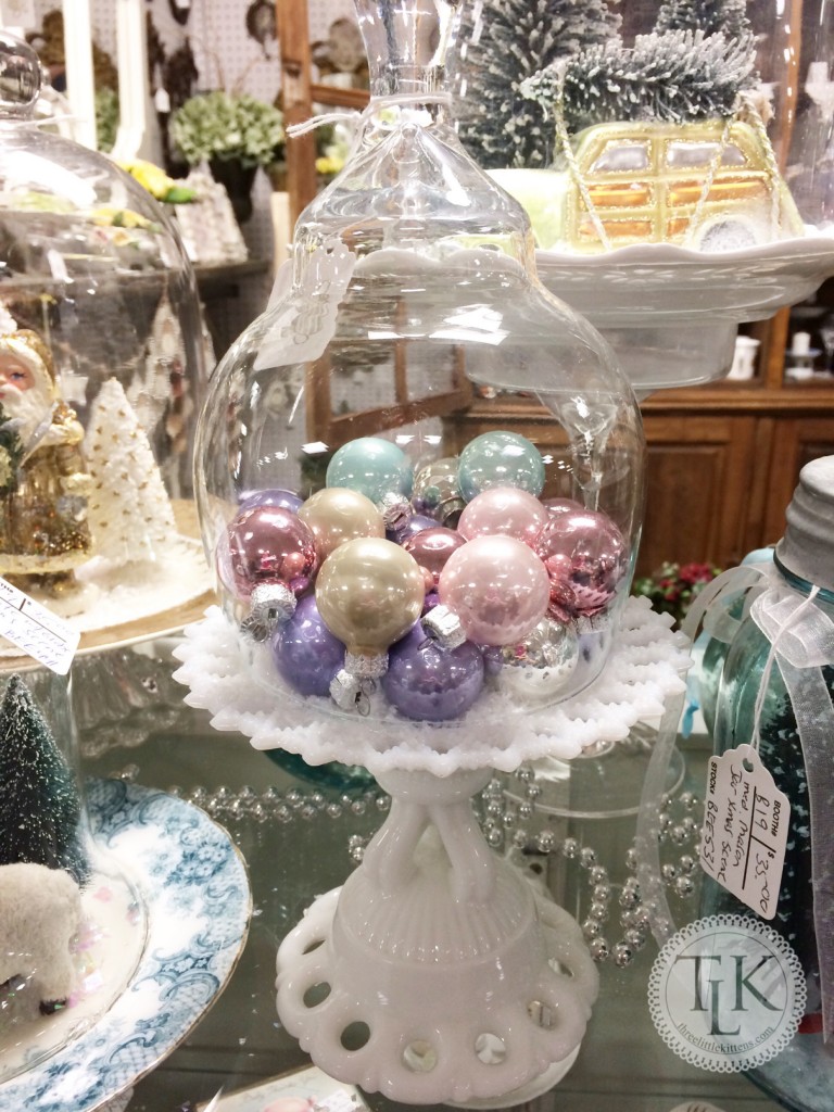 Cake Plate of Pastel Ornaments under a Cloche