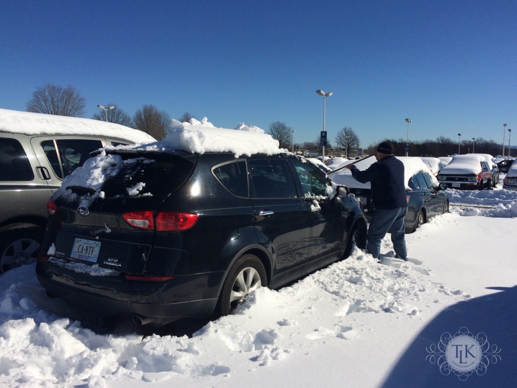 Keith digging out our car at the airport after winter storm Jonas